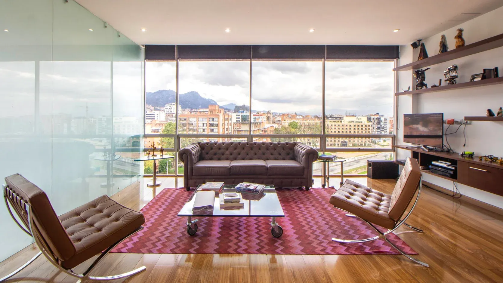 Luxury penthouse living room with floor-to-ceiling skyline views